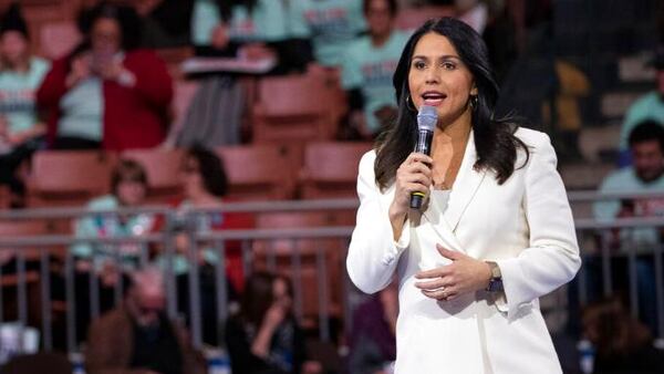 On Friday, former Democratic U.S. Rep. Tulsi Gabbard campaigned with Republican U.S. Senate hopeful Herschel Walker. (Mary Altaffer/AP)
