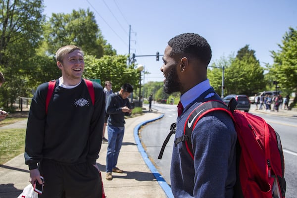 Destin Mizelle, right, a third year psychology student at the University of Georgia and newly elected SGA treasurer, talks with Cayman Bickerstaff, left, a third year cellular biology student at the University of Georgia, in between classes on the University of Georgia campus in Athens, Georgia, on Tuesday, April 17, 2018. (REANN HUBER/REANN.HUBER@AJC.COM)