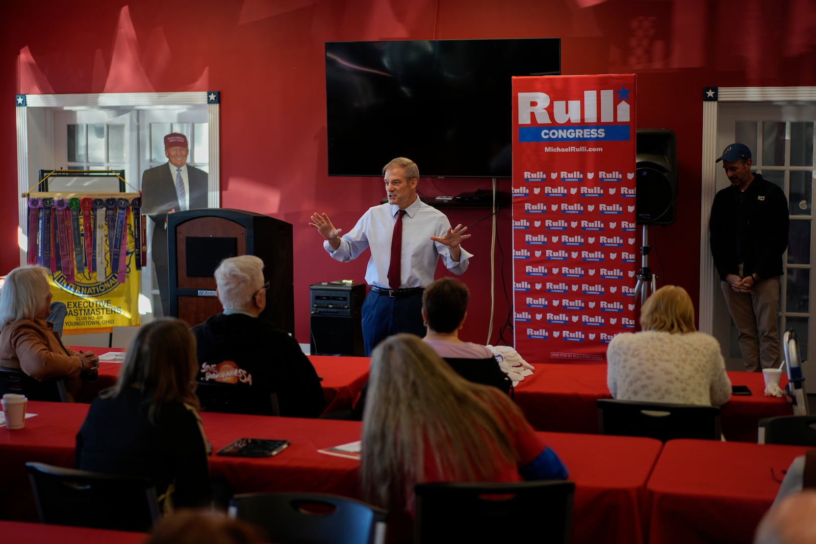 Rep. Jim Jordan, R-Ohio, speaks at a rally for Rep. Michael Rulli, R-Ohio, standing right, at the Mahoning County Republican Party headquarters in Boardman, Ohio, Thursday, Oct. 17, 2024. A cardboard cutout of Republican presidential nominee former President Donald Trump is seen left. (AP Photo/Carolyn Kaster)