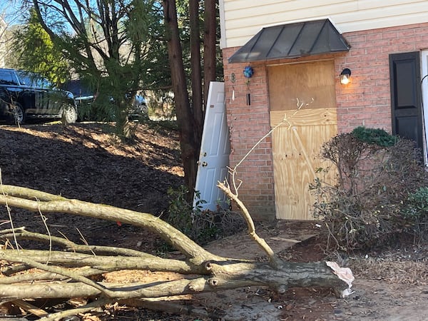 The door of Unit 1310 of the Shoal Creek Apartment Complex in Athens after being struck by a vehicle Sunday morning. Georgia offensive lineman Devin Willock and football staff member Chandler LeCroy died in the accident.