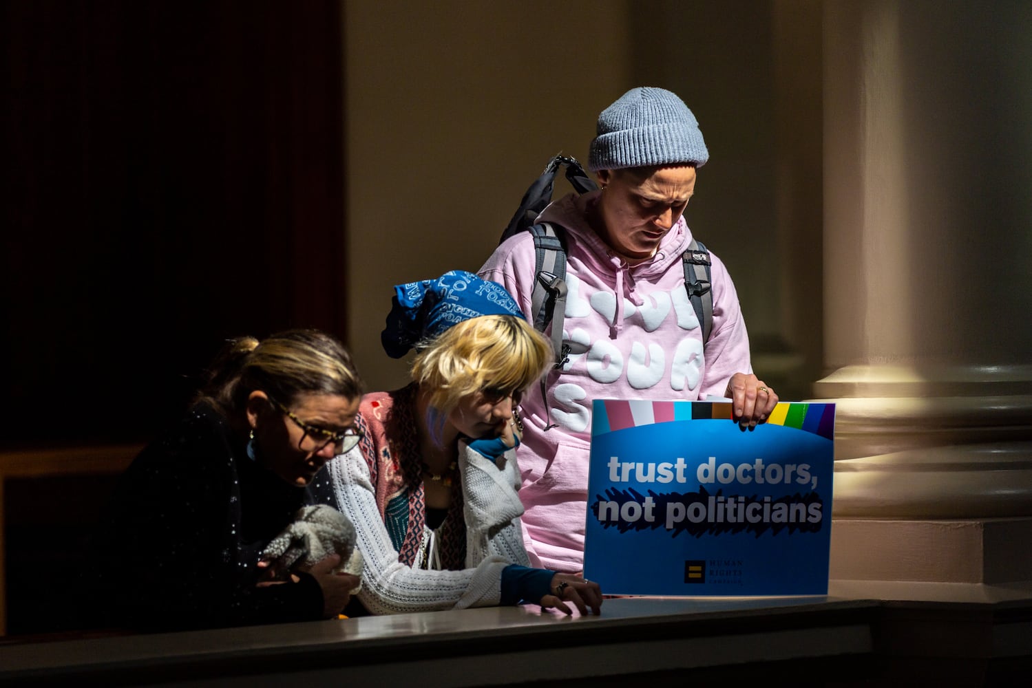 Opponents of SB 140, a bill that would prevent medical professionals from giving transgender children certain hormones or surgical treatment, gather in the Capitol in Atlanta on Monday, March 20, 2023. (Arvin Temkar / arvin.temkar@ajc.com)