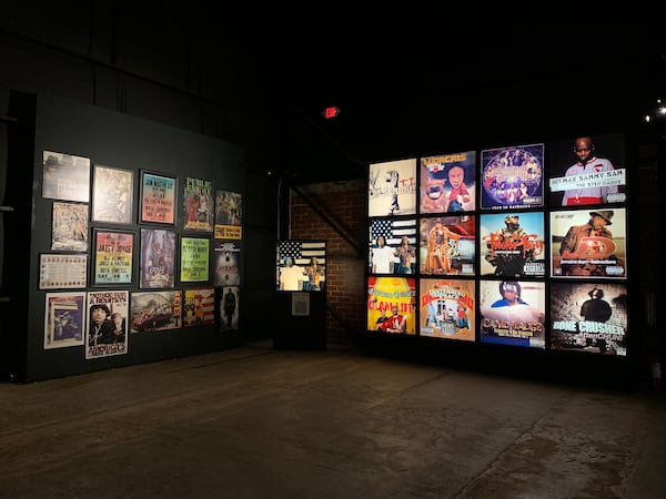 Walls showcasing past concerts and album covers feature in "You Don't Got Dis: A Legacy of Hip Hop."