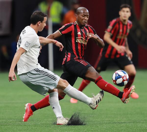 July 21, 2019 Atlanta: Atlanta United midfielder Darlington Nagbe defends against D.C. United Leonardo Jara blocking his pass in a soccer match on Sunday, July 21, 2019, in Atlanta.   Curtis Compton/ccompton@ajc.com