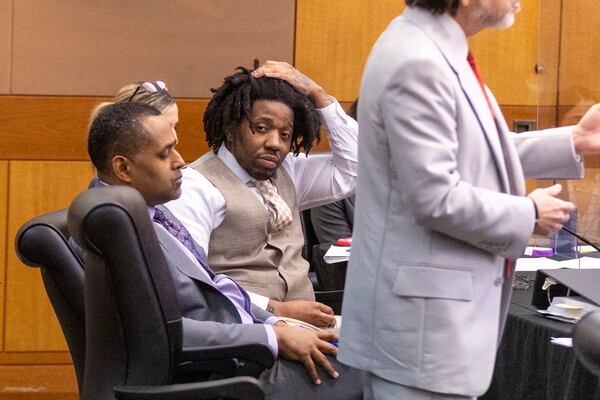 Atlanta rapper YFN Lucci, whose real name is Rayshawn Bennett, sits with his attorneys during his plea deal Tuesday in a Fulton County Courtroom. (Steve Schaefer/steve.schaefer@ajc.com)