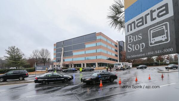 A Verizon employee was hit by two vehicles and killed shortly after getting off a MARTA bus, officials said. JOHN SPINK / JSPINK@AJC.COM