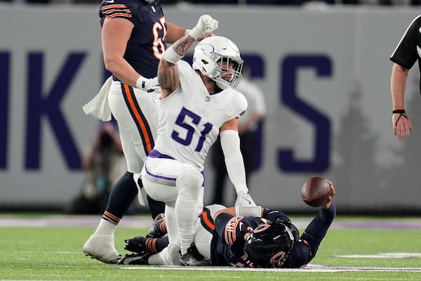 Minnesota Vikings linebacker Blake Cashman (51) celebrates a defensive stop during the first half of an NFL football game against the Chicago Bears, Monday, Dec. 16, 2024, in Minneapolis. (AP Photo/Abbie Parr)