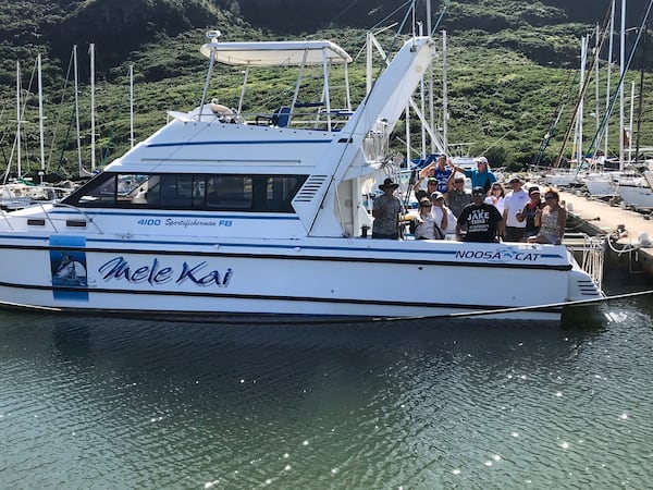 About a dozen of former Georgia and NFL star Jake Scott’s friends boarded the “Mele Kai,” his beloved fishing boat, one last time at Hanalei Pier in Hawaii. Their mission was to take Scott's ashes and spread them on Hanalei Bay. (Courtesy of Jake Scott's family)