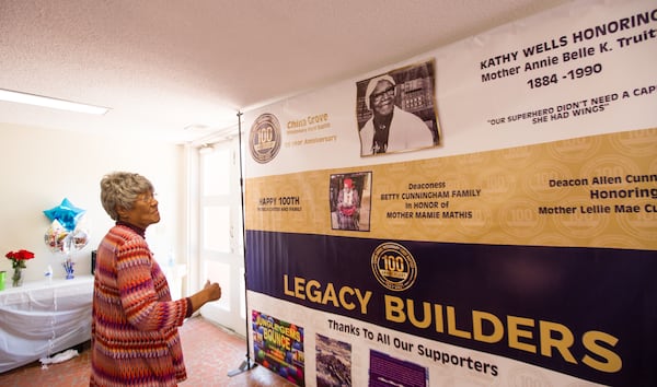 The China Grove Missionary Baptist Church started in a home 100 years ago and still serves the Lynwood Park Community on Thursday, April 1, 2021.  Francis Steele, is a mother at the church and she remembers the original church with no air conditioning when she was a child.  The banner is from the 100 year celebration.  (Jenni Girtman for The Atlanta Journal-Constitution)