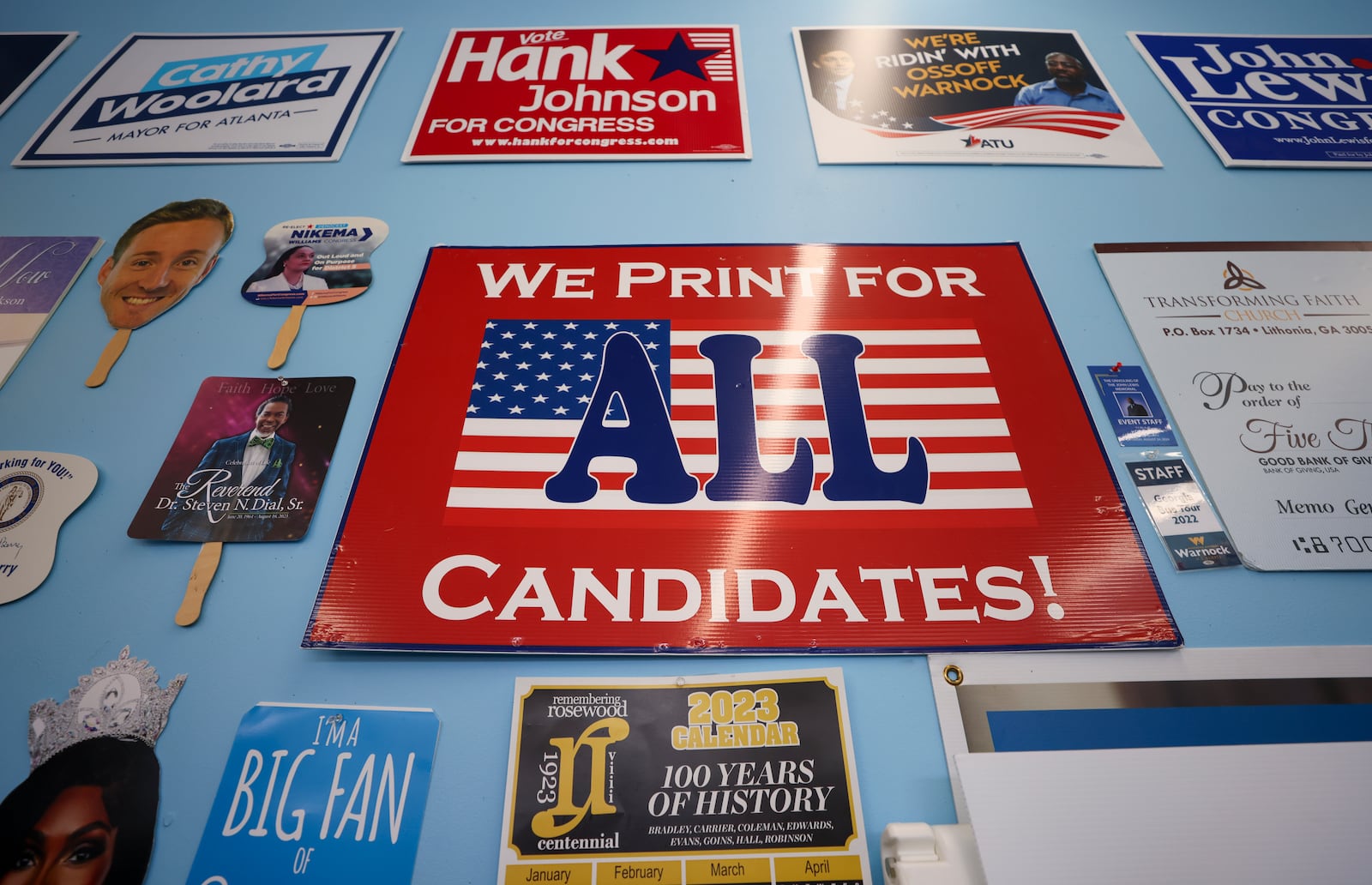 A sign reads, “We Print For All Candidates!,” is shown at the print shop, Best Print & Design, Tuesday, October 15, 2024, in Decatur, Ga. (Jason Getz / AJC)

