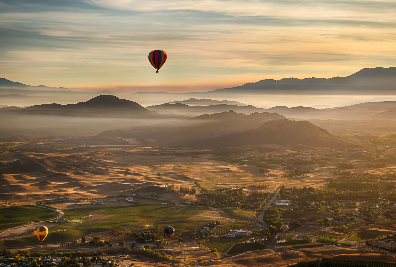 View Temecula Valley’s lakes, citrus groves, wineries, estates, mountains and wildlife from above with a serene sunrise balloon ride. CONTRIBUTED BY COLIN MICHAELIS