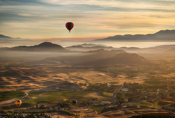 View Temecula Valley’s lakes, citrus groves, wineries, estates, mountains and wildlife from above with a serene sunrise balloon ride. CONTRIBUTED BY COLIN MICHAELIS