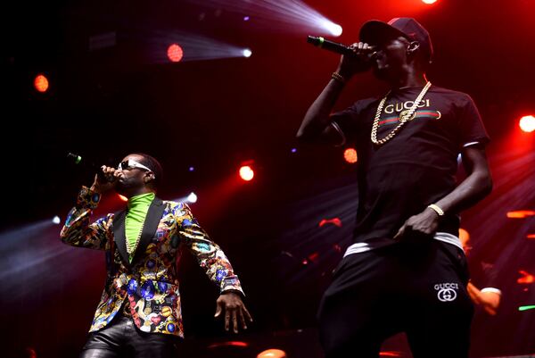 Juicy J (left) and Crunchy Black (right), members of the Academy Award winning rap group Three 6 Mafia, helped kick off day one of One Musicfest at Centennial Park. The music festival is celebrating is 10th anniversary. RYON HORNE/RHORNE@AJC.COM