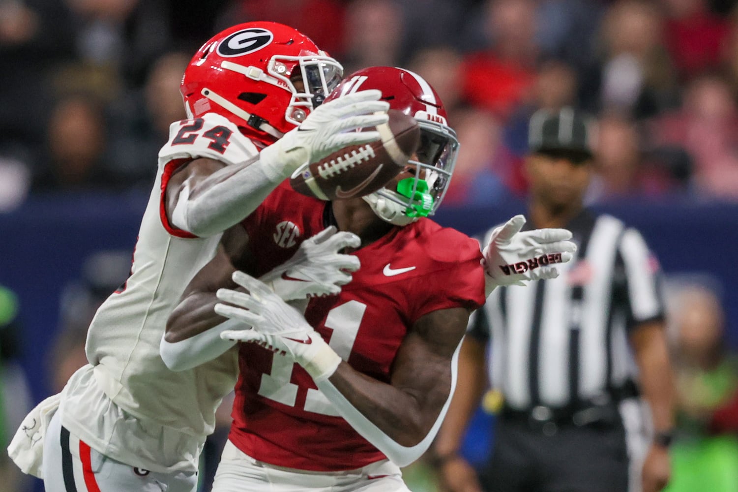 Georgia Bulldogs defensive back Malaki Starks (24) blocks Alabama Crimson Tide wide receiver Malik Benson (11) during the first half of the SEC Championship football game at the Mercedes-Benz Stadium in Atlanta, on Saturday, December 2, 2023. (Jason Getz / Jason.Getz@ajc.com)