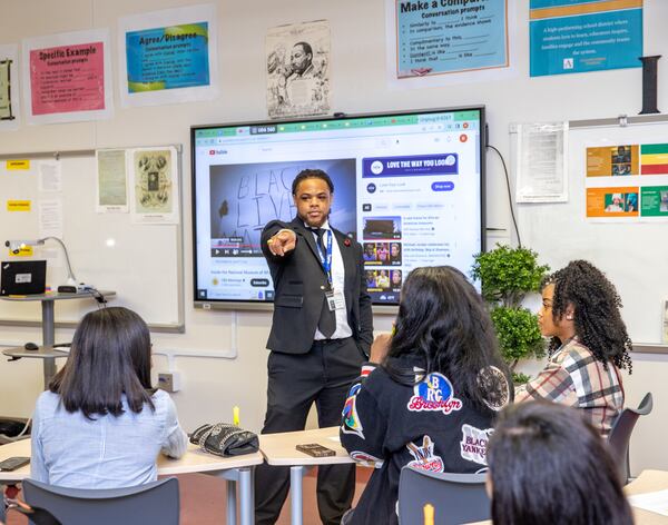 Rashad Brown teaches Advanced Placement African American Studies at Maynard Jackson High School on Friday, Feb. 17, 2023. (Jenni Girtman for The Atlanta Journal-Constitution)