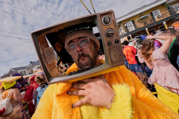 Tony Burgesen has some fun during the Society of Saint Anne's parade on Mardi Gras Day, Tuesday, March 4, 2025 in New Orleans. (AP Photo/Gerald Herbert)