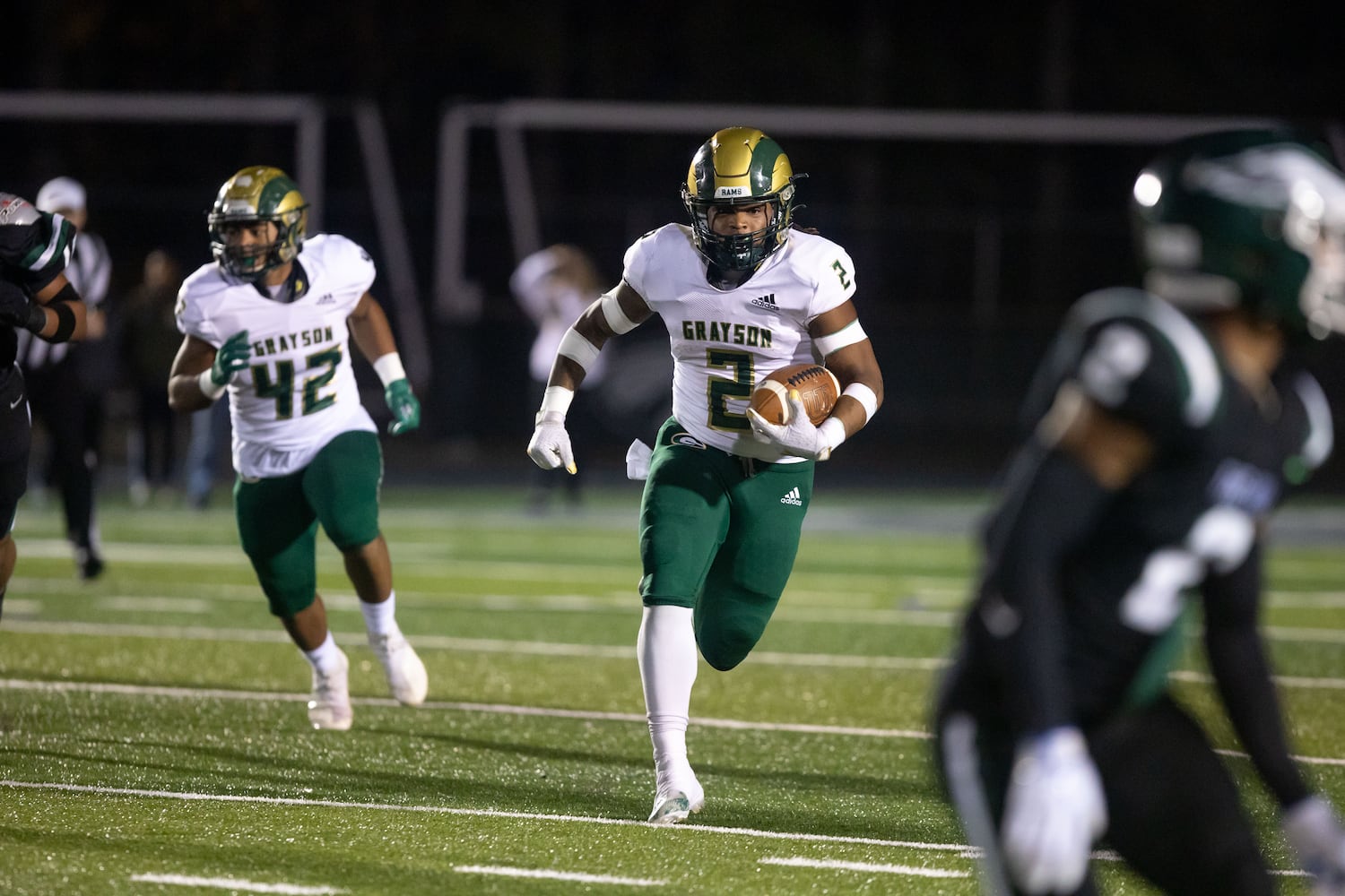 Grayson's Joseph Taylor Jr. (2) runs the ball during a GHSA high school football game between the Collins Hill Eagles and the Grayson Rams at Collins Hill High in Suwanee, GA., on Friday, December 3, 2021. (Photo/ Jenn Finch)