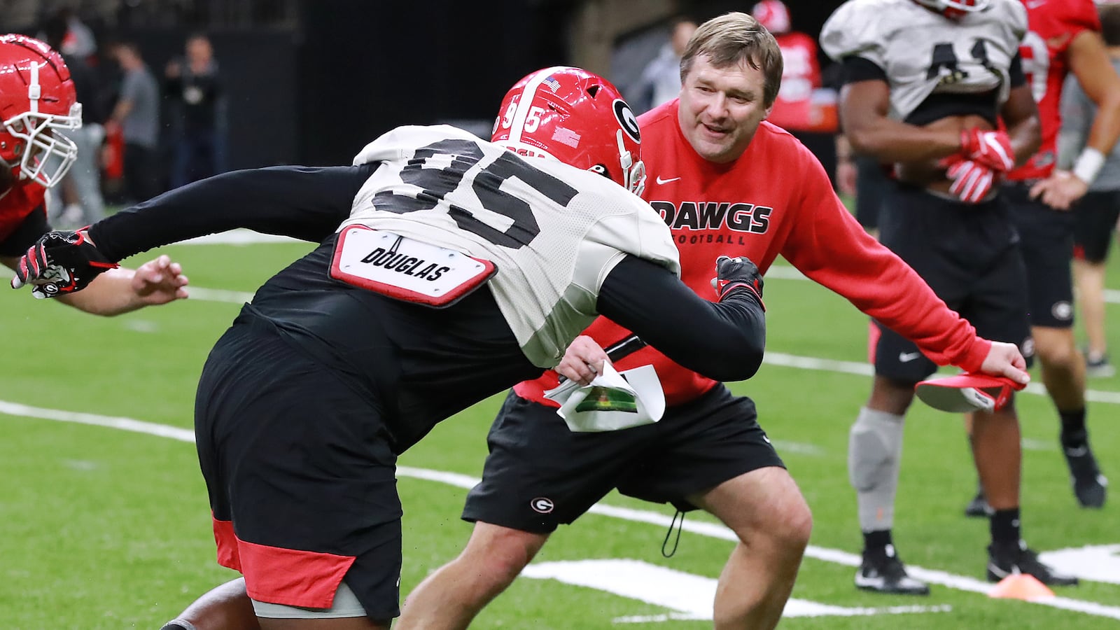 Georgia head coach Kirby Smart runs defensive lineman Devonte Wyatt through a drill during team practice for the Sugar Bowl Saturday, Dec. 28, 2019, at the Mercedes-Benz Superdome in New Orleans.