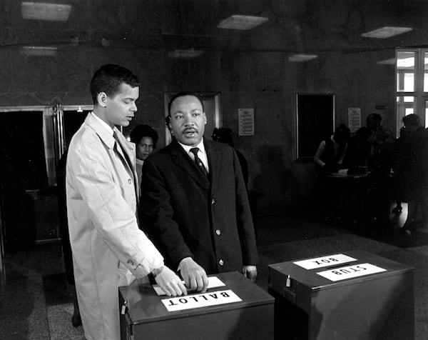 This is a photo of Julian Bond and Dr. Martin Luther King Jr. casting their ballots in 1966. (AP Photo)