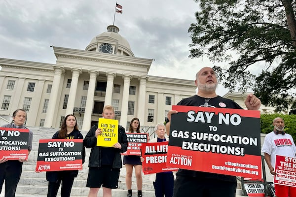 FILE - Abraham Bonowitz, front, executive director of Death Penalty Action, and other death penalty opponents hold a demonstration outside the Alabama Capitol in Montgomery, Ala., Wednesday, Sept. 25, 2024. (AP Photo/Kim Chandler, File)