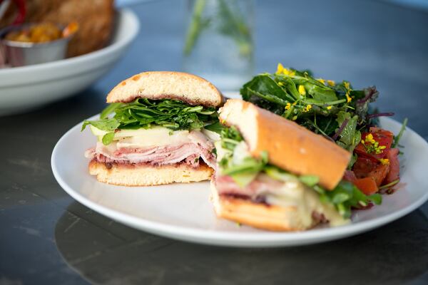  The Sarah-Witch with"Southern baguette," brie, Beech Creek pink lady apples, shaved ham, arugula and house preserves. Photo credit- Mia Yakel.