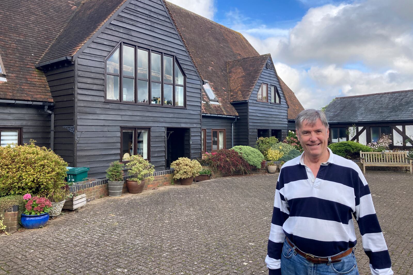 Stewart Lewis poses near his home in Abbots Langley, England, on Friday, Oct. 18, 2024. Plans to build a data center in a field on Abbots Langley's outskirts has pitted the national government's priorities against the interests of local villagers. (AP Photo/Peter Morgan)