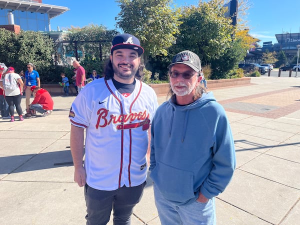 Braves supporters Sean and Greg Castille traveled from Annapolis, Md. to support the Braves in Game 3 of the National League Division Series against the Phillies on Wednesday at Citizens Bank Park in Philadelphia.