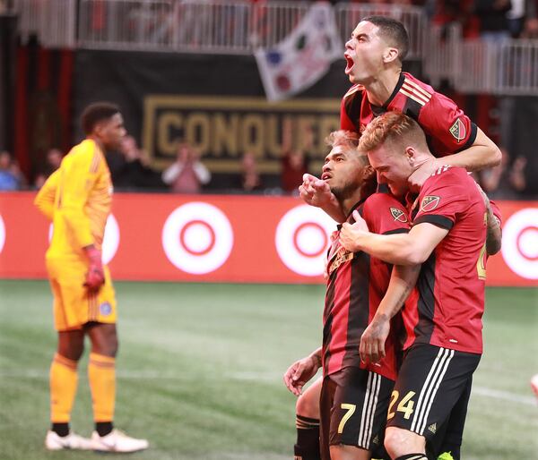 Nov 11, 2018 Atlanta: Atlanta United Josef Martinez celebrates scoring the teamâs first goal against goalkeeper Sean Johnson on a penalty kick for a 1-0 lead over New York City with teammates Miguel Almiron and Julian Gressel during the first half in their MLS Eastern Conference Semifinal playoff match on Sunday, Nov. 11, 2018, in Atlanta.  Curtis Compton/ccompton@ajc.com