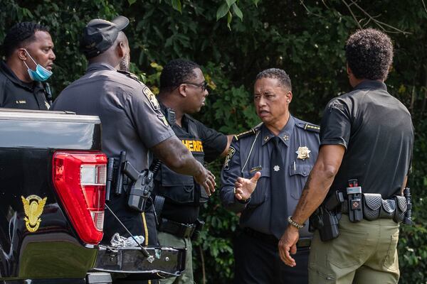 Sheriff Patrick Labat talks to officials at the Fulton County Jail while waiting for former President Donald Trump’s arrival in Atlanta on Thursday, August 24, 2023. (Katelyn Myrick/katelyn.myrick@ajc.com)