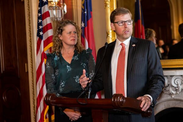 John Isakson speaks as his sister Julie Mitchell listens at gather to honor their late father, former U.S. Senator Johnny Isakson, R-GA, at the U.S. Capitol building on Dec. 14, 2022 in Washington, DC. (Nathan Posner for the Atlanta Journal-Constitution)