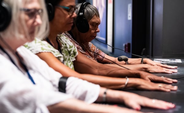 Rev. Dr. Cynthia Roddey, (far right), participates in an exhibit simulating a civil rights era lunch counter sit-in with her daughter-in-law Lorie Blount, center, and Blount’s mother Robbie Luck at the National Center for Civil and Human Rights in Atlanta on Thursday, July 11, 2024. Roddey was the first African-American graduate student to enroll at Winthrop University. (Seeger Gray / AJC) 