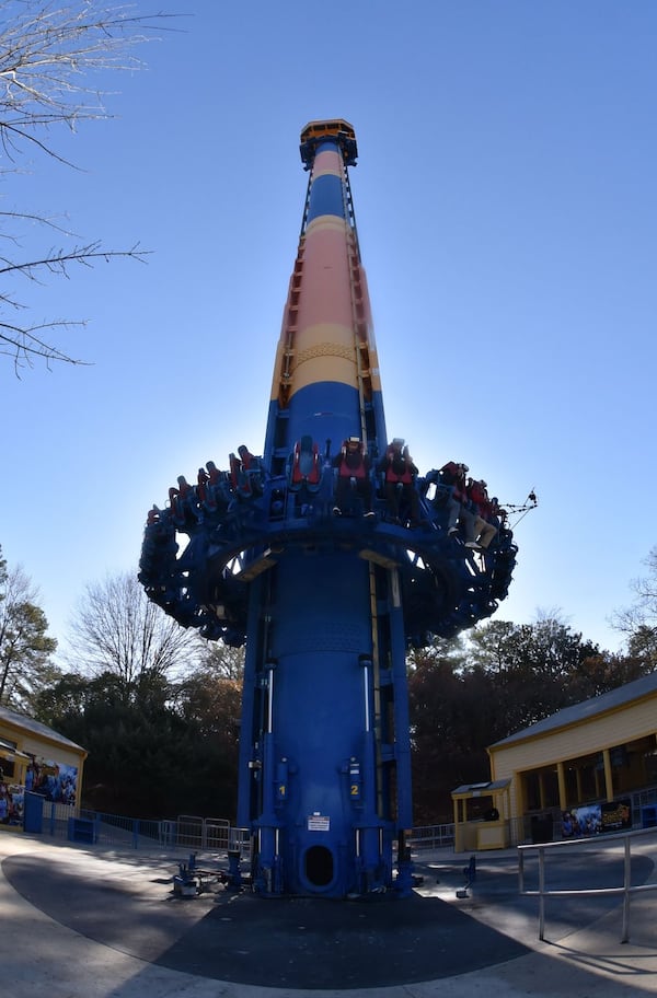 Members of the media ride Drop of Doom VR, a new virtual reality version of the Acrophobia drop tower, at Six Flags Over Georgia this week. Using Samsung Gear VR powered by Oculus, riders become the pilots of a futuristic gunship under attack by mutant spiders. The technology makes the ride up seem to be 100 stories, not the actual 20. Six Flags Over Georgia will open for the season on Saturday, March 11. HYOSUB SHIN / HSHIN@AJC.COM