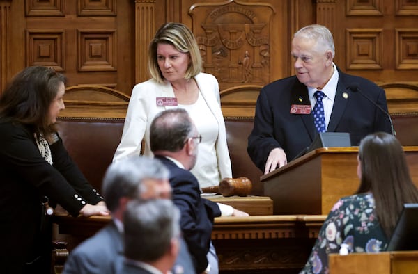 House Speaker David Ralston (right) and Speaker Pro-Tempore Jan Jones confer with staff as the afternoon session gets underway during Crossover Day in the Georgia General Assembly In Atlanta on Tuesday, March 15, 2022. Bills and resolutions need passage in either the House or the Senate by Crossover Day to be considered by the other chamber for passage this year. (Bob Andres / robert.andres@ajc.com)