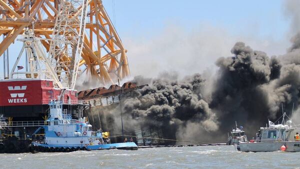 debris recovery teams are still collecting melted plastic and charred debris from the fire. Car bumpers and other large parts have been fished from the water surrounding the shipwreck, Himes said, while thousands of smaller car pieces have been picked up along the beaches of nearby St. Simons Island and Jekyll Island. (AJC file photo)