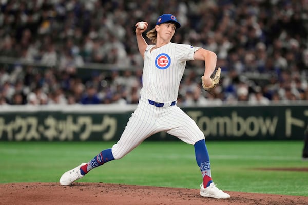 Chicago Cubs' Ben Brown throws to the Los Angeles Dodgers in the fifth inning of an MLB Japan Series baseball game in Tokyo, Japan, Tuesday, March 18, 2025. (AP Photo/Eugene Hoshiko)