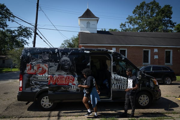 Members of the Black Voters Matter Fund prepare their van for a tour of Alabama’s 2nd Congressional District at New Bayside Baptist Church in Mobile, Ala., June 15, 2024. The newly drawn majority-Black district was established after the U.S. Supreme Court ruled that Alabama's previous congressional map was racially gerrymandered and diluted the Black vote. (Photo by Jordan Moore/News21)