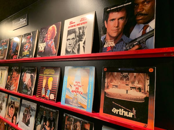 While Anthony SantAnselmo's Woodstock basement fake video rental store has more than 8,000 VHS tapes, he also has a handful of laser discs on display as well . RODNEY HO/rho@ajc.com