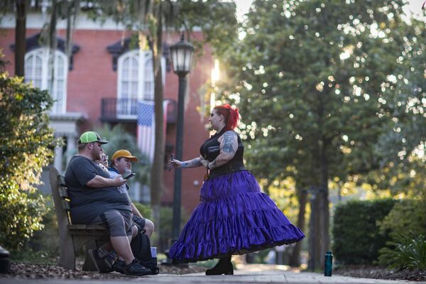 SAVANNAH, GA - MAY 28, 2024: Lady Ravenwood, right, with 6th Sense World, speaks with three clients during her tour on Monterey Square near the famous Mercer House, Tuesday, May 28, 2024, in Savannah, Ga.  (AJC Photo/Stephen B. Morton)