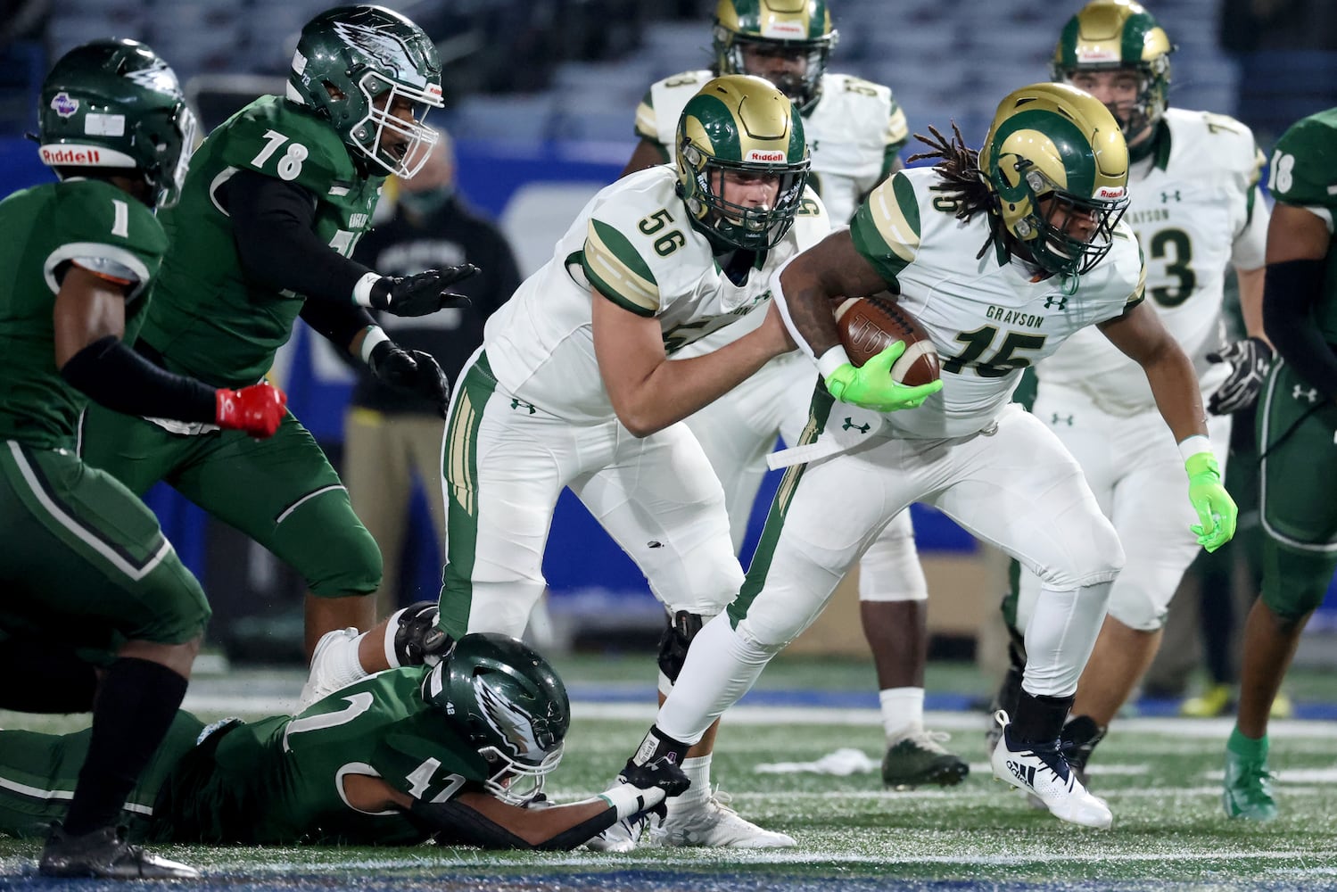 Dec. 30, 2020 - Atlanta, Ga: Grayson running back Joseph Taylor (15) runs for yards against Collins Hill linebacker Logan Birdsong (42) as offensive lineman Walker Williams (56) blocks in the first half of the Class 7A state high school football final at Center Parc Stadium Wednesday, December 30, 2020 in Atlanta. JASON GETZ FOR THE ATLANTA JOURNAL-CONSTITUTION