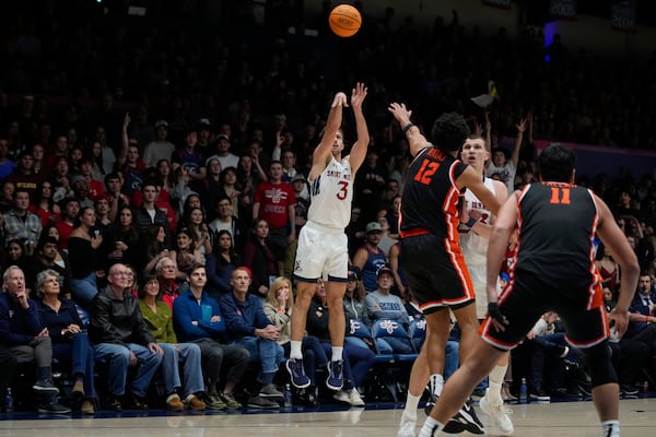 Saint Mary's guard Augustas Marciulionis (3) shoots a 3-point basket during the first half of an NCAA college basketball game against Oregon State, Saturday, March 1, 2025, in Moraga, Calif. (AP Photo/Godofredo A. Vásquez)