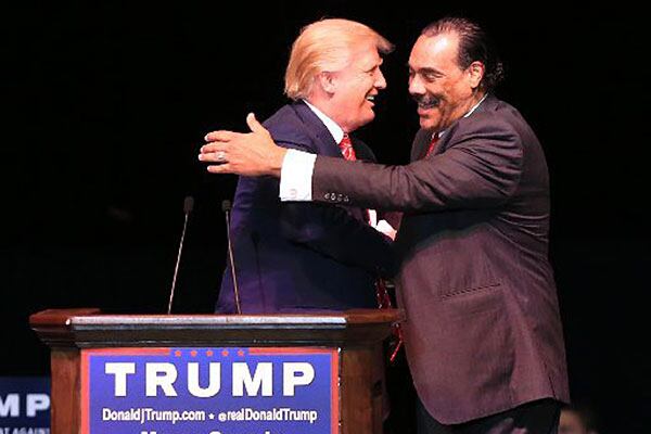 Bruce LeVell, right, embraces Donald Trump. He's an adviser to the former president and former GOP chair of Gwinnett County. He'll be part of the state's delegation to the Republican National Convention in Milwaukee. AJC file