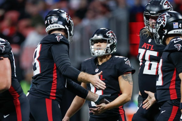 Atlanta Falcons punter Bradley Pinion (13) speaks with Atlanta Falcons place kicker Younghoe Koo (6) after missing a field goal during the first half of an NFL football game against the Los Angeles Chargers on Sunday, December 1, 2024, at Mercedes-Benz Stadium in Atlanta. 
(Miguel Martinez/ AJC)