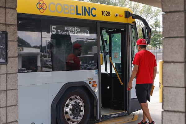 Passengers board the CobbLinc  transit bus at the Marietta Transit Center on Monday, Sept. 23, 2024. (Natrice Miller/ AJC)