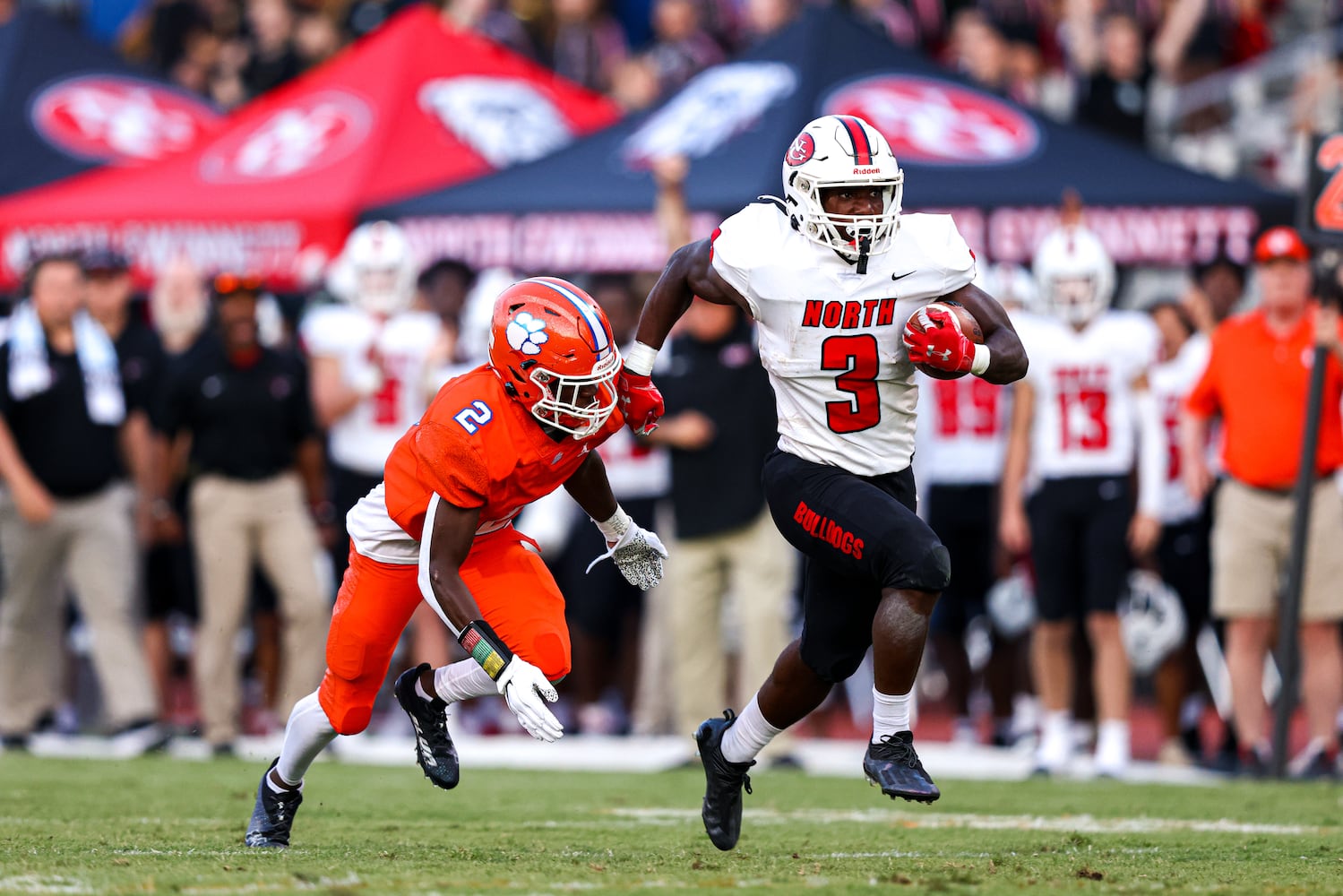 North Gwinnett running back Marcus McFarlane (3) runs the ball as Parkview defensive back Champ Baker (2) closes in during a GHSA 7A high school football game between the North Gwinnett Bulldogs and the Parkview Panthers at Parkview High School in Lilburn, Ga., on Friday, Sept. 3, 2021. (Casey Sykes for The Atlanta Journal-Constitution)