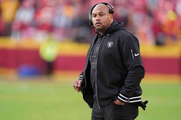 Las Vegas Raiders head coach Antonio Pierce watches from the sideline during the first half of an NFL football game against the Kansas City Chiefs in Kansas City, Mo., Friday, Nov. 29, 2024. (AP Photo/Charlie Riedel)