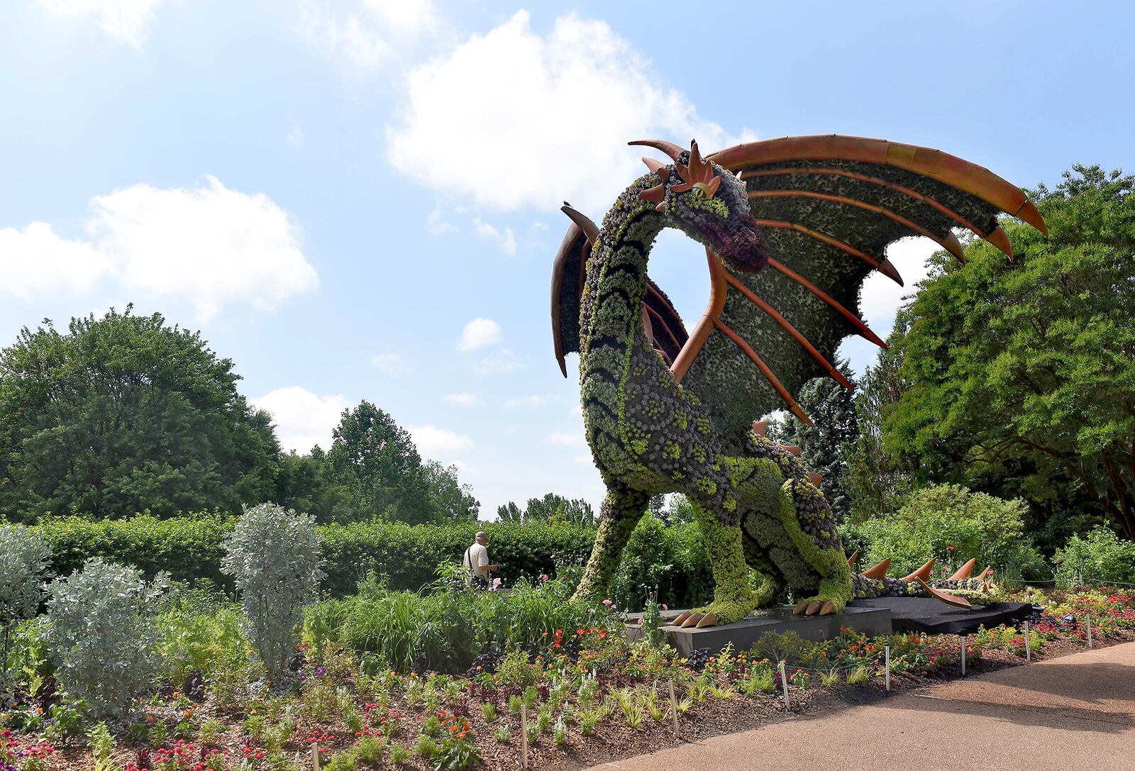 The dragon sculpture, returning from last summer, is one of the oversized sculptures created of metal frames and living plants. RYON HORNE / RHORNE@AJC.COM