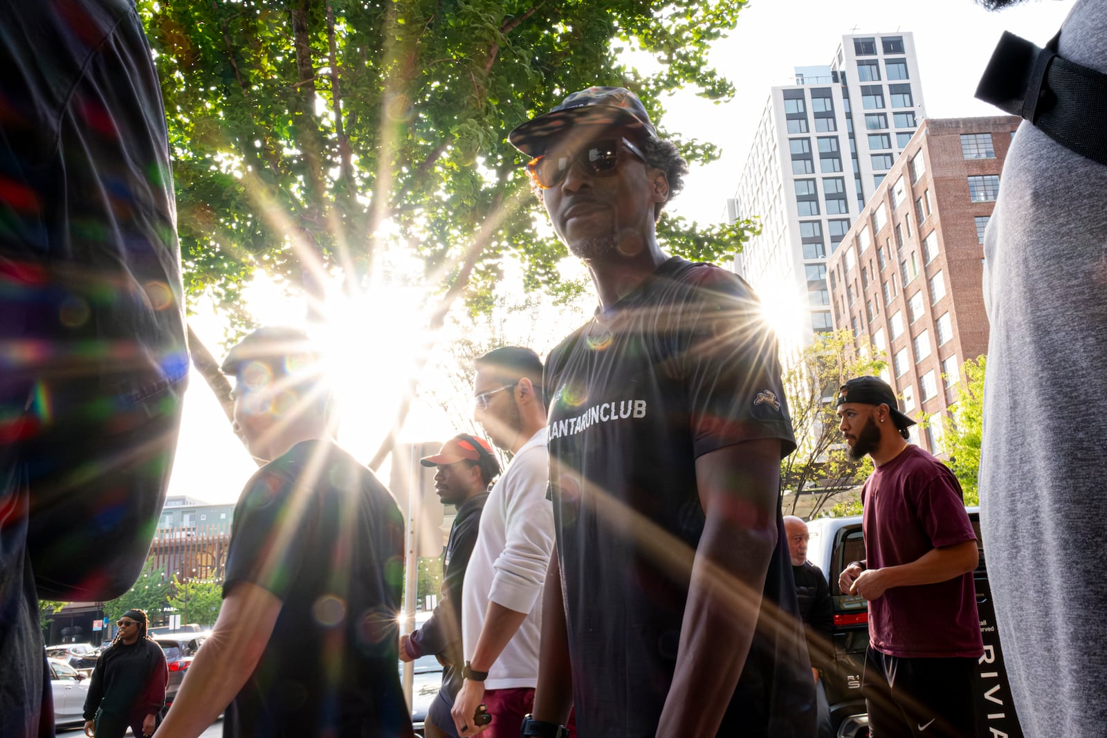 Maurice Garland, a run lead with the Atlanta Run Club, mingles before the start of their Monday night run at Ponce City Market on Monday, March 25, 2024.   (Ben Gray / Ben@BenGray.com)