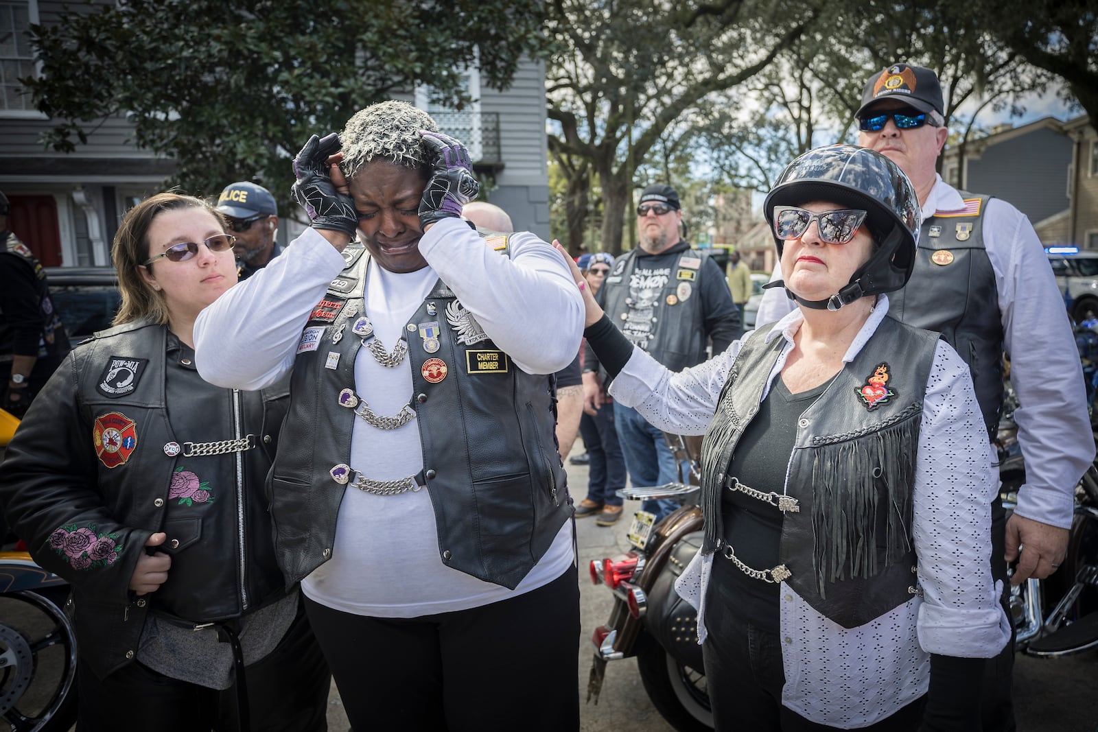 SAVANNAH, GA - JANUARY 15, 2024: Dana Fisher, center left, and  members of the American Legion Riders Post 184 react outside Campbell and Sons Funeral Home after the remains of U.S. Army Reservist Sgt. Breonna Moffett were brought inside, Thursday, Feb. 15, 2024, Savannah, Ga. Moffett was killed in a drone attack in January along with two other U.S. servicemen in Jordan. (AJC Photo/Stephen B. Morton)