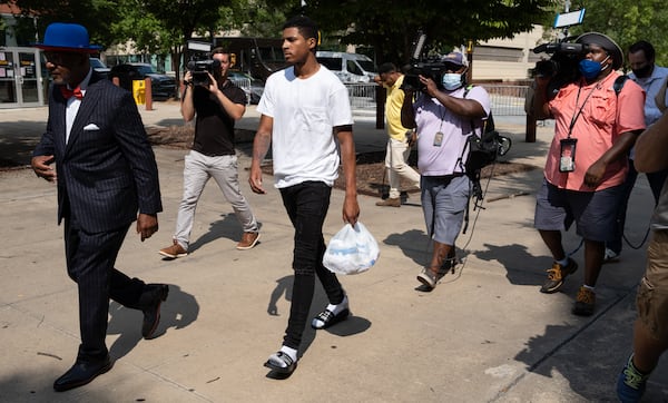 Julian Conley, who is accused of felony murder in the shooting death of 8-year-old Secoriea Turner, turns himself in to the Atlanta Police Department with his attorney Jackie Patterson on Wednesday afternoon July 15, 2020. (Ben Gray for The Atlanta Journal-Constitution)