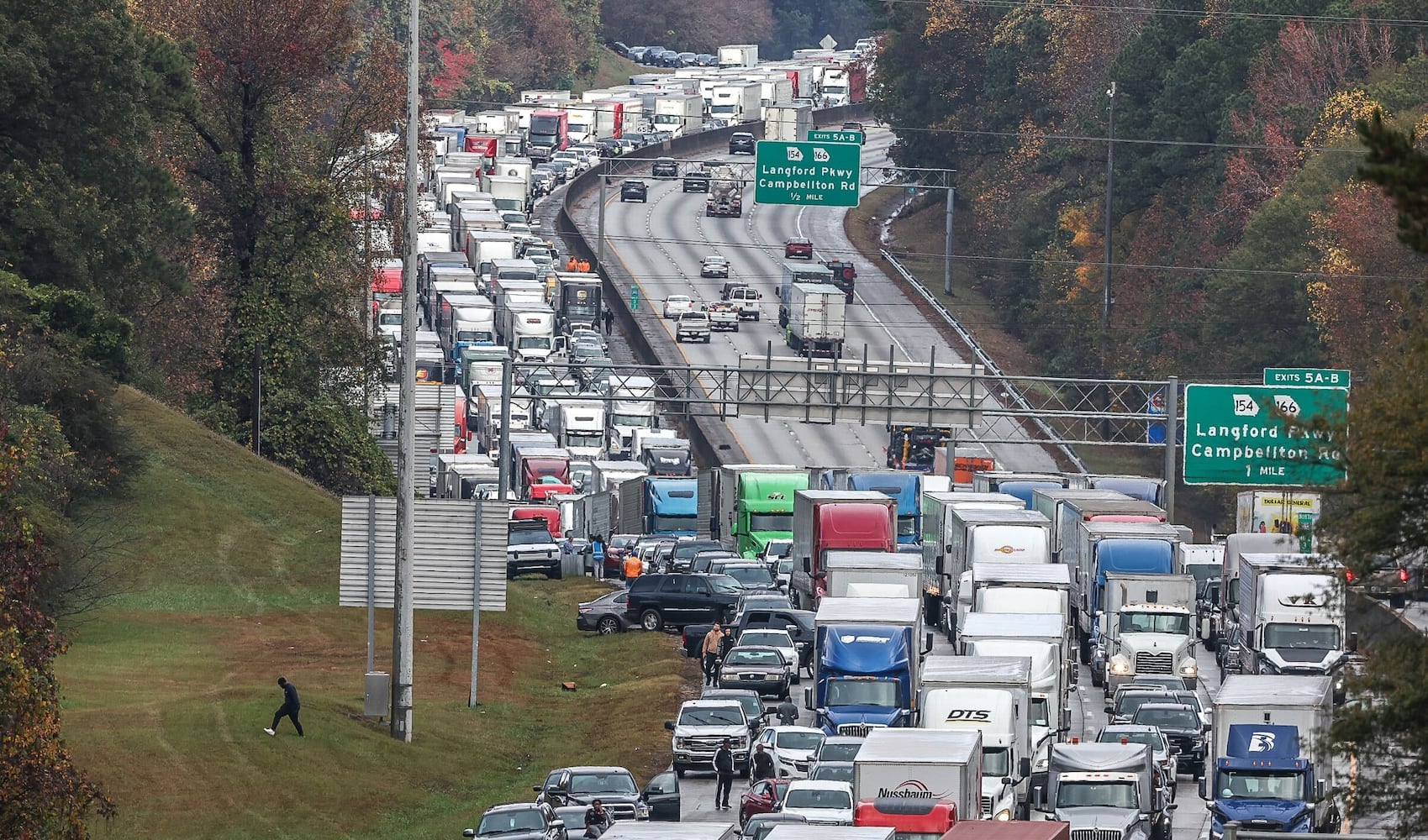 2 East Point officers hurt in I-285 crash near airport; traffic jammed for miles