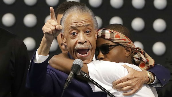 Rev. Al Sharpton, left, hugs Stevante Clark while speaking during the funeral services for Clark's brother, Stephon, Thursday, March 29, 2018, at Bayside of South Sacramento Church. Stephon Clark, 22, was killed March 18 after two Sacramento police officers fired 20 shots at him as he stood on his grandparents' back patio. Clark, a father of two small boys, was unarmed.